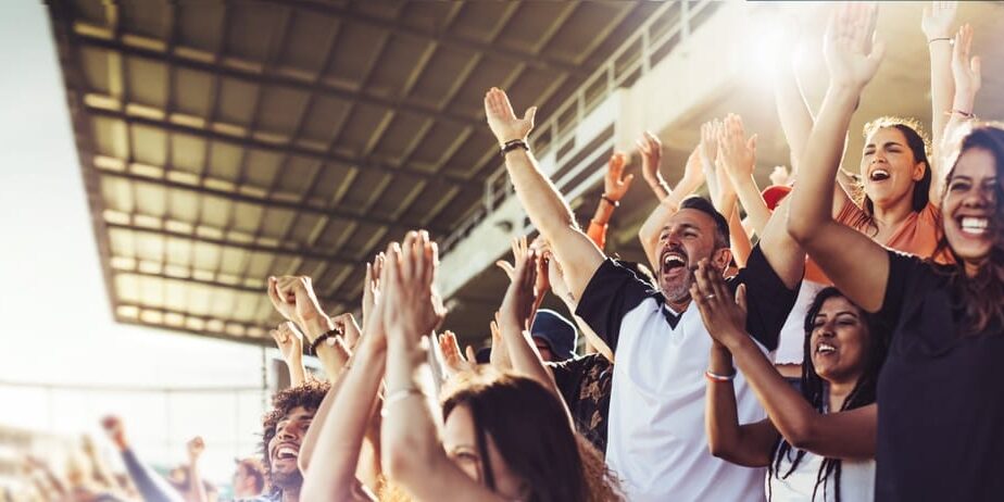 Crowd,Of,Sports,Fans,Cheering,During,A,Match,In,Stadium.